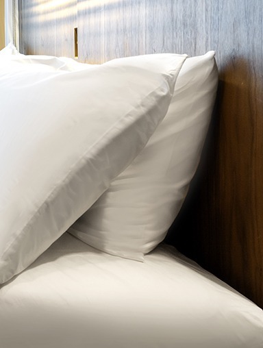 Comfortable bedding with fluffy pillows for a good night's rest